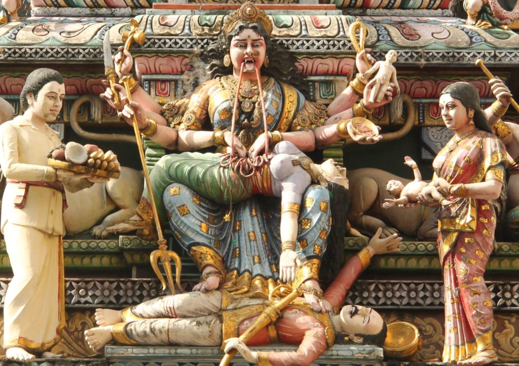 Kali devouring a human being